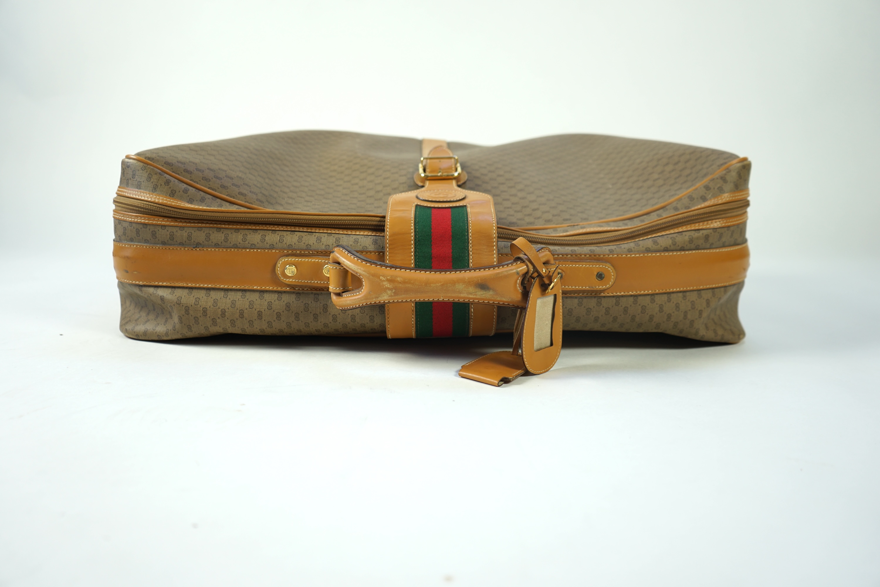 A vintage Gucci micro GG monogram canvas suitcase